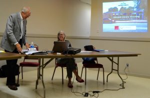 Greg Lukmire (left) and Toni Garvey confer prior to a wrap-up on the sessions aimed at soliciting feedback about a new library center.