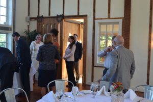 Members of the Chadds Ford Business Association socialize before hearing a presentation from Paul Redman, executive director of Longwood Gardens.