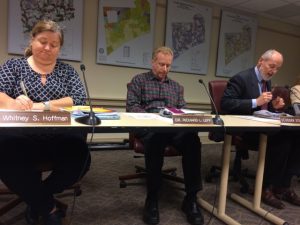 Kennett Township Supervisors Whitney S. Hoffman (from left), Richard L. Leff, and Scudder G. Stevens review materials during Wednesday night's meeting.