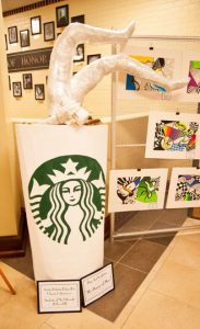 Student artists Dakota Kilgariff and Clarisse Confrancesco offer some social commentary on modern man’s thirst for caffeine with this pop art sculpture they call The “Desire of Man.”