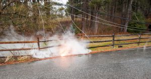Electricity buzzes through downed power lines causing open flame on Bullock Road